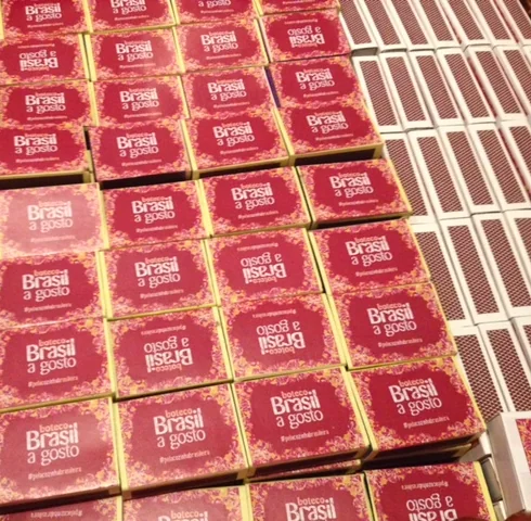 Rows of boteco matchboxes with the Brasil a Gosto logo